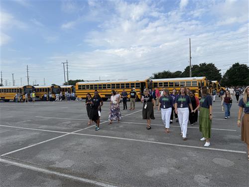 buses unloading faculties from schools